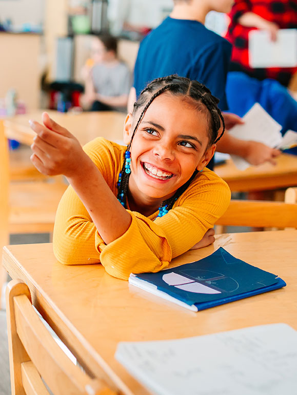 Happy Sunny Hollow Montessori Student in Classroom
