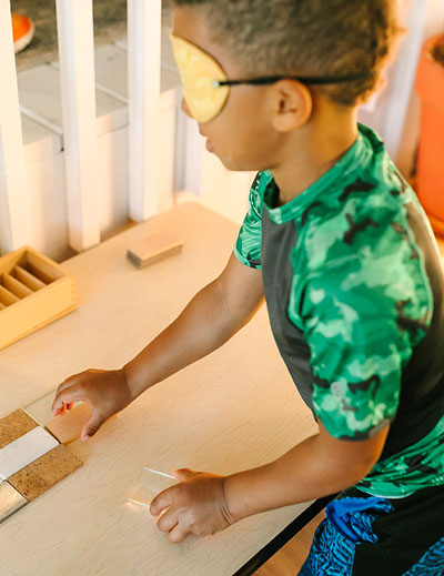 Montessori student working on sensory