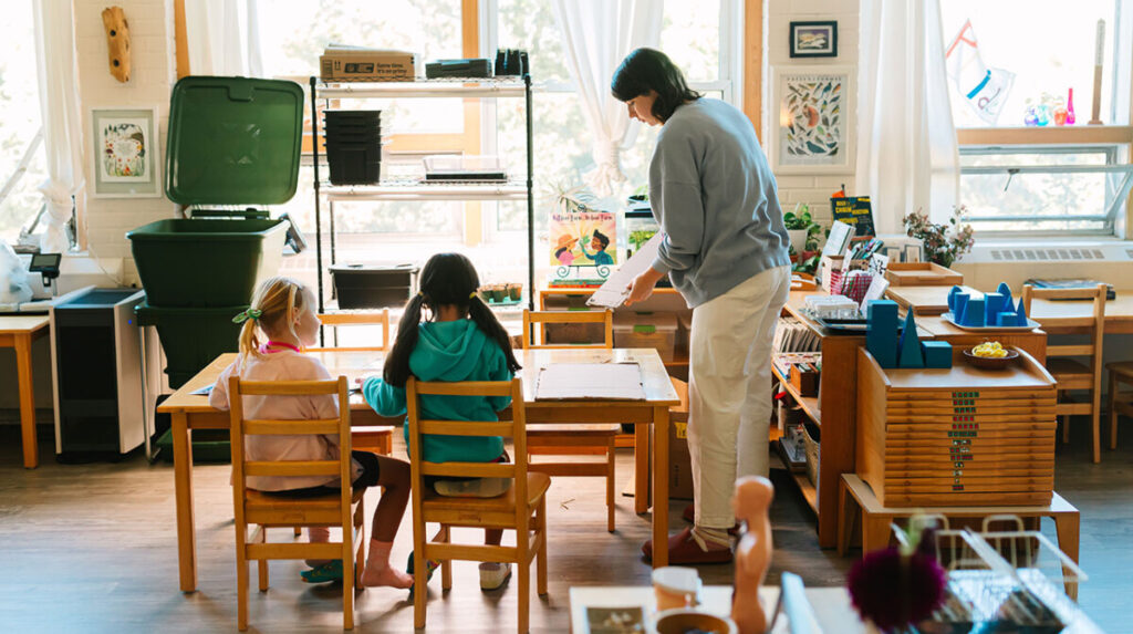 Montessori classroom with teacher and students