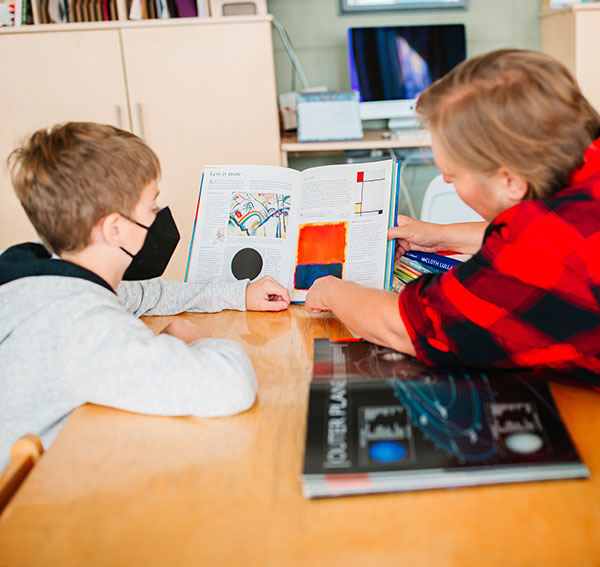 Montessori student learning with their teacher