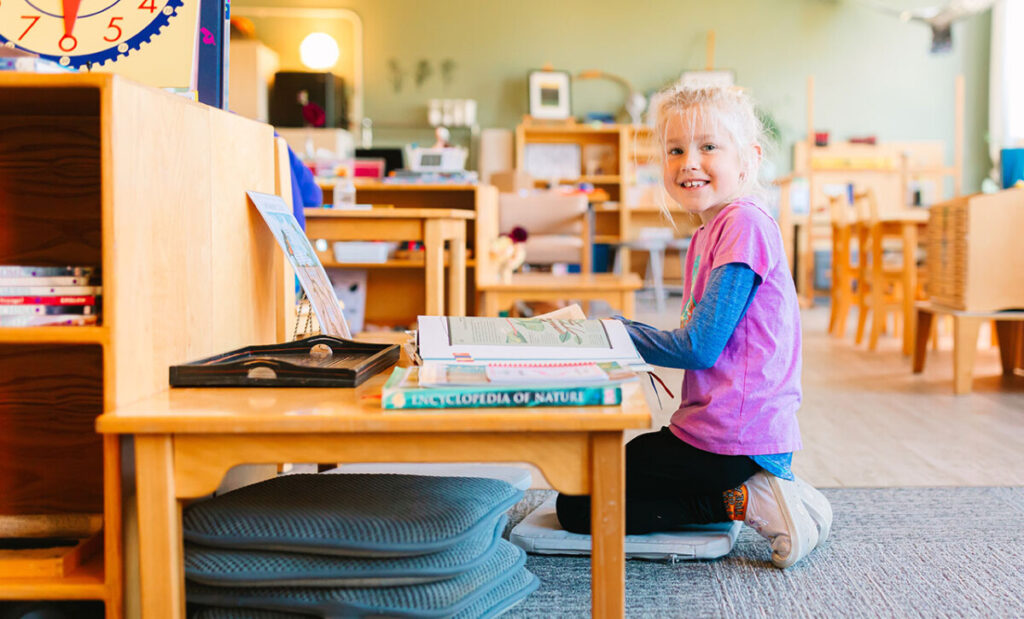 Extended Day, girl reading books