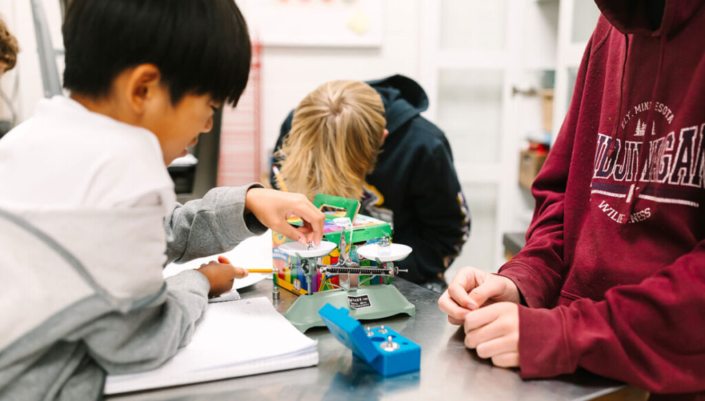 Extended Day, students working with a weight scale