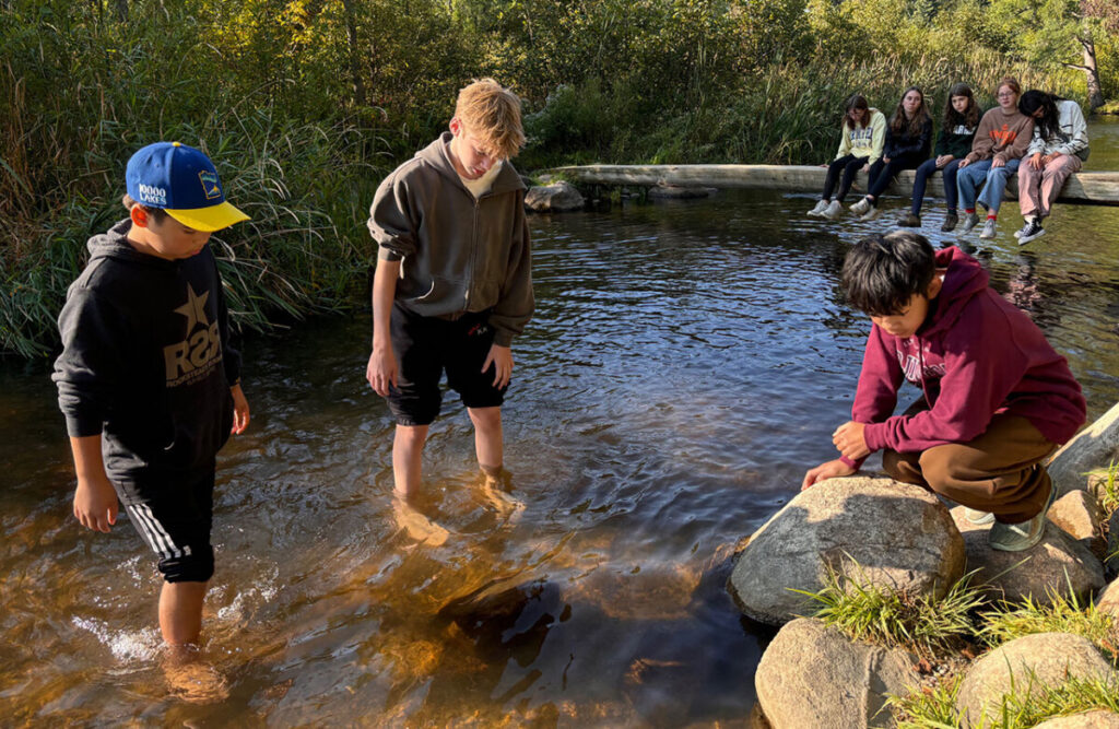 Students exploring the river