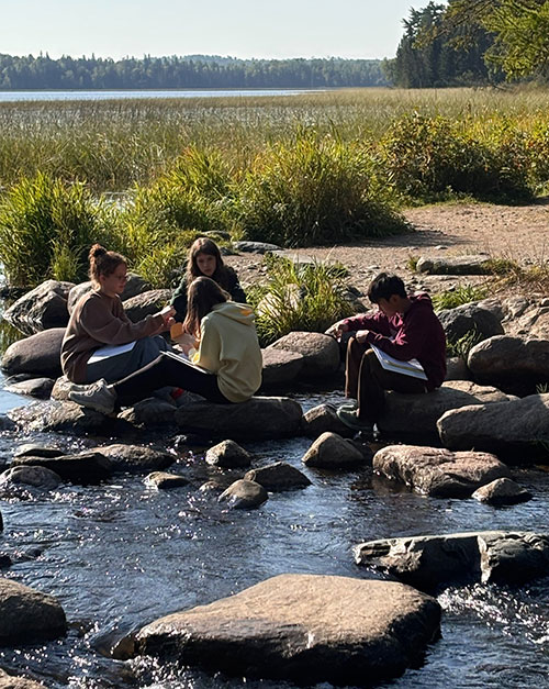 Students by the lake