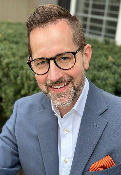 Brett Robison (He/Him) Executive Director